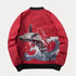 Red embroidered bomber baseball jacket with whale and wave design, featuring stand collar and rib sleeve cuffs.